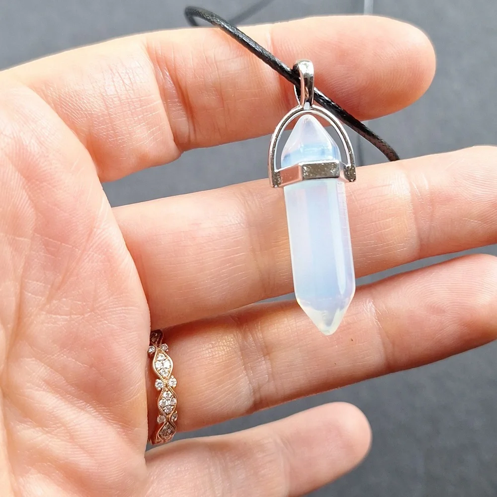 Clear crystal point pendant necklace on 16-inch faux leather chain